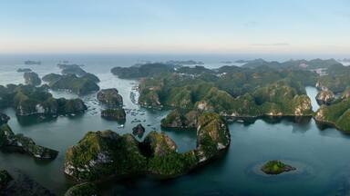 A coastal landscape with numerous small islands surrounded by water.