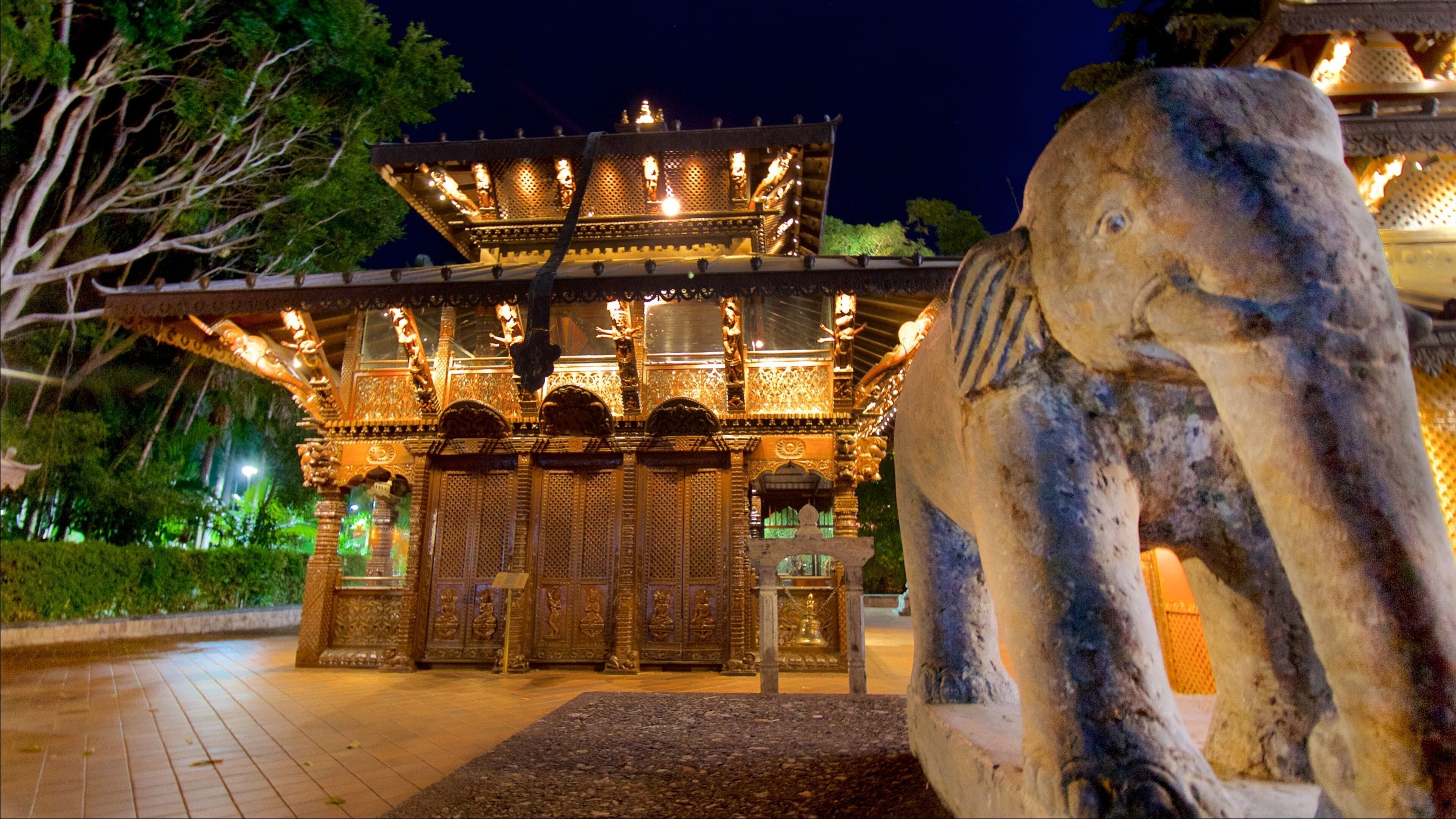 Southbank Parklands featuring a statue or sculpture, a temple or place of worship and night scenes