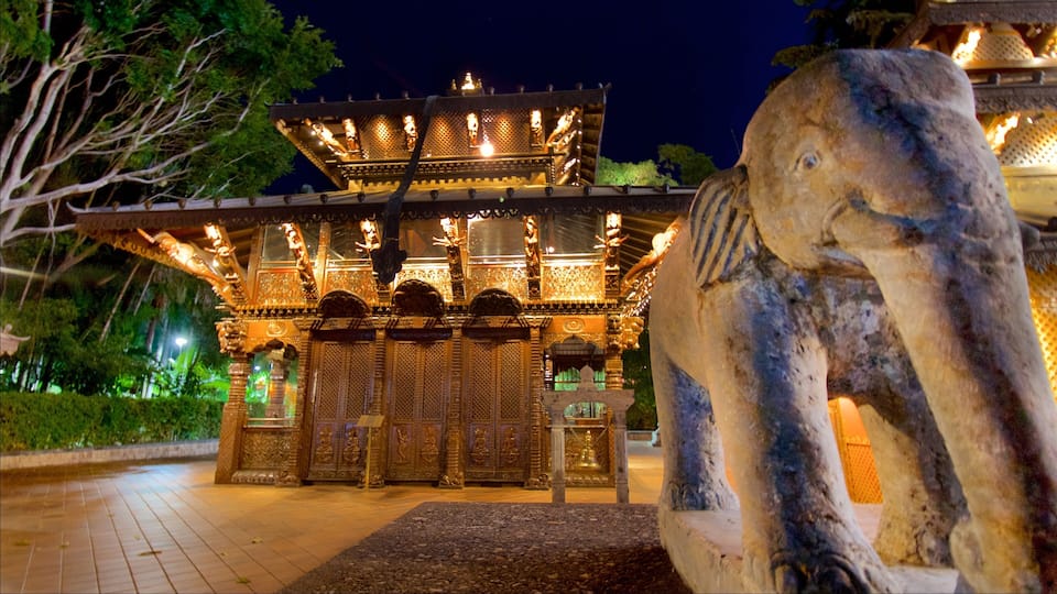 Southbank Parklands featuring a statue or sculpture, a temple or place of worship and night scenes