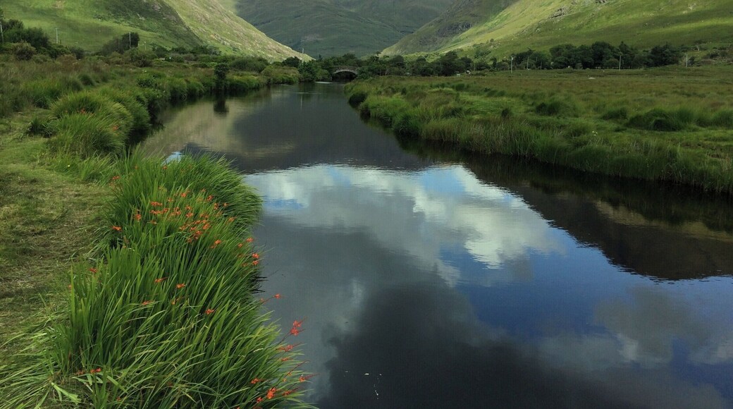 This is a peaceful and gentle sheltered river set in a mountainous and rugged landscape. A river, particularly loved by fishermen.