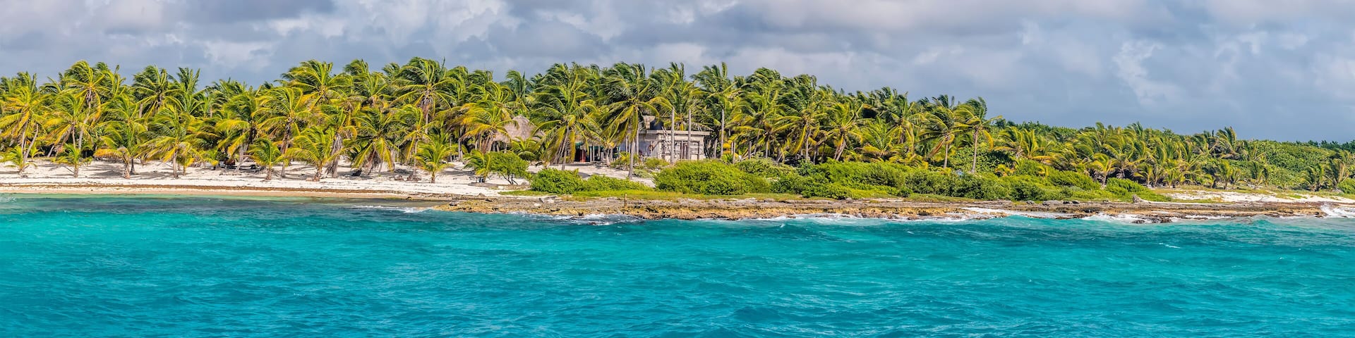 A view along the beach and shoreline at the mexican resort of Costa Maya on the Yucatan peninsula on a sunny day