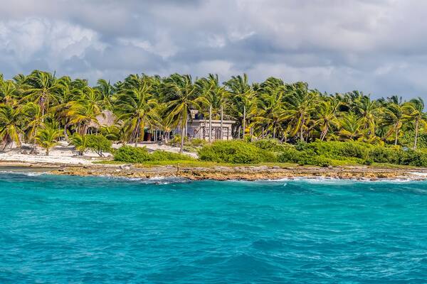A view along the beach and shoreline at the mexican resort of Costa Maya on the Yucatan peninsula on a sunny day