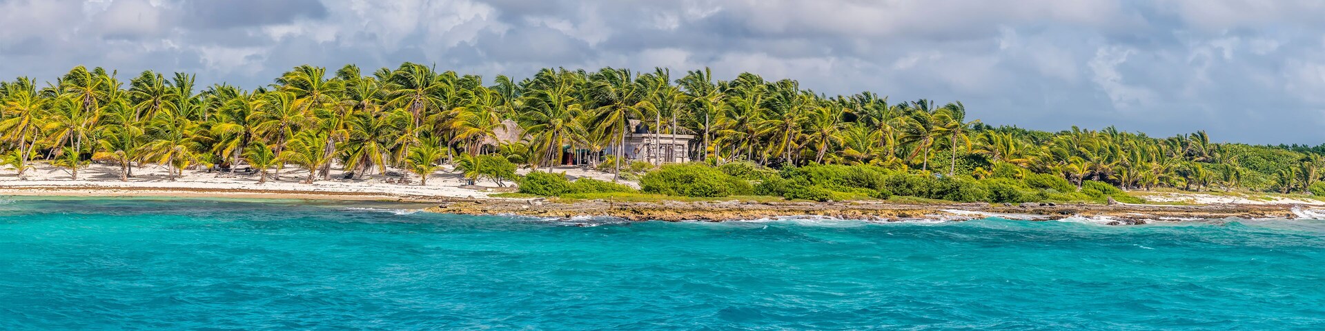 A view along the beach and shoreline at the mexican resort of Costa Maya on the Yucatan peninsula on a sunny day