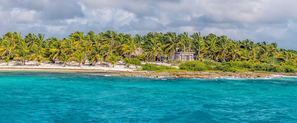 A view along the beach and shoreline at the mexican resort of Costa Maya on the Yucatan peninsula on a sunny day