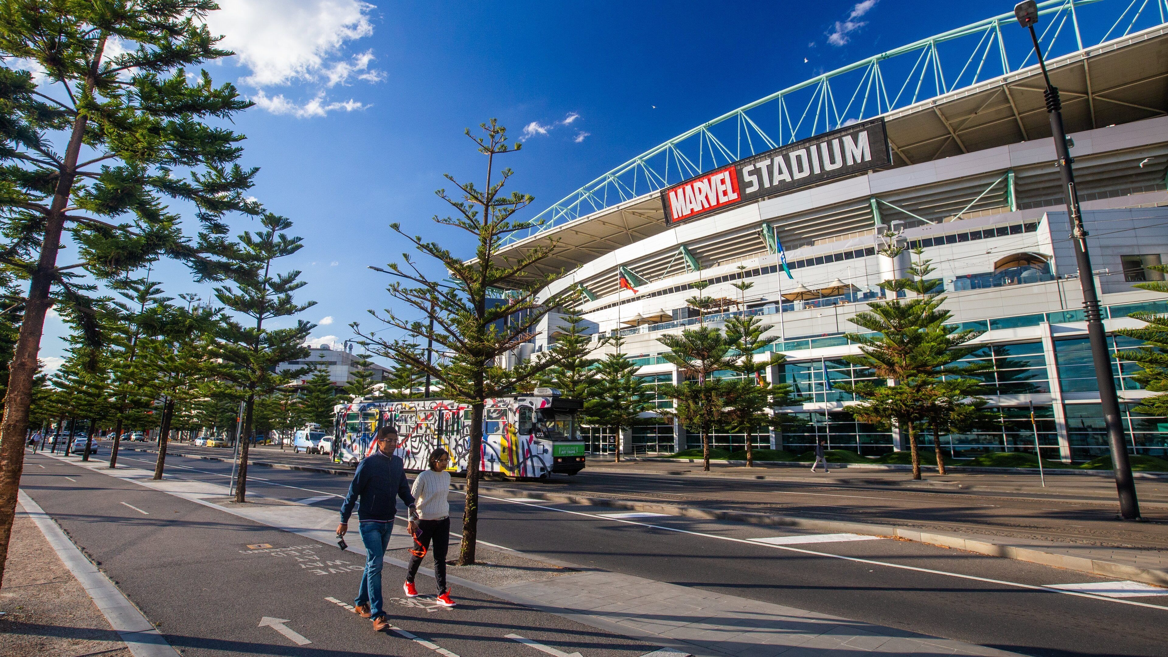 Marvel Stadium featuring street scenes and signage as well as a couple
