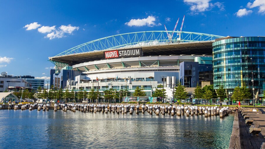 Marvel Stadium showing a bay or harbor and signage