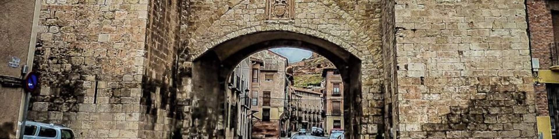 Daroca is a city in the province of Zaragoza. It's a fortified complex surrounded by walls built between the thirteenth and sixteenth century and preserved almost in its entirety. Stands out two defensive doors at the two main entrances to the city. The Puerta Baja (Picture here), remodeled in the sixteenth century with two square towers, and the Puerta Alta, transformed in the seventeenth century.