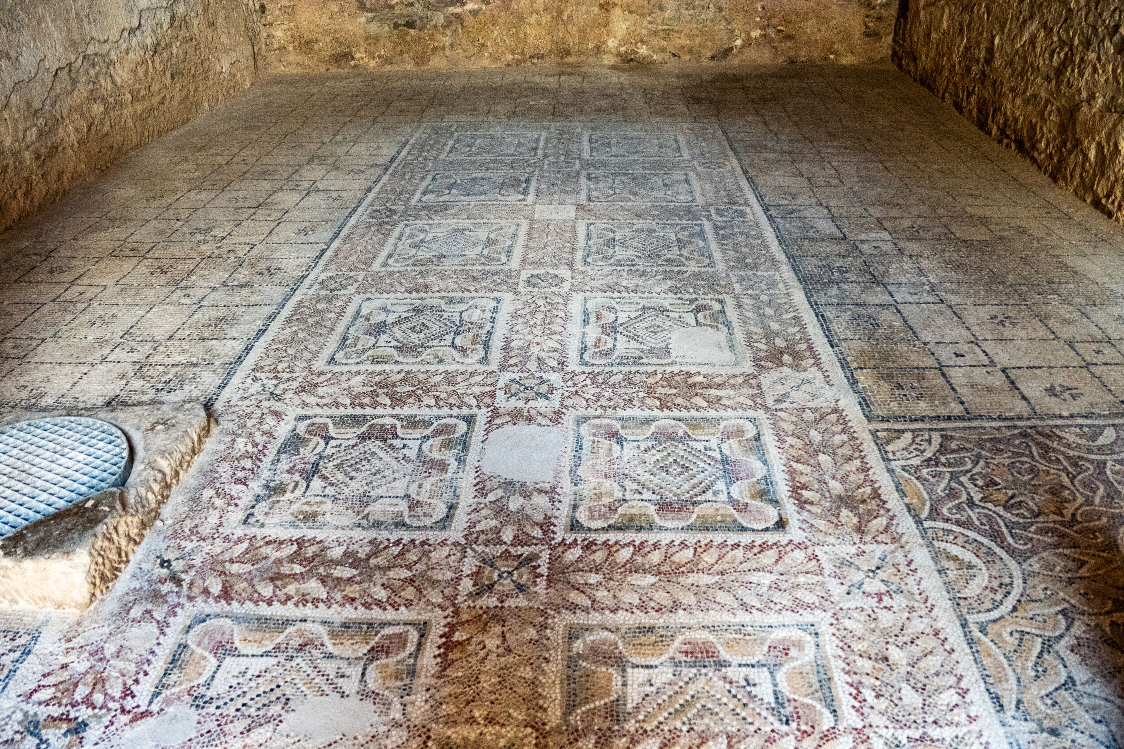 Mosaic with geometric patterns on the floor of an underground room in an ancient villa at Bulla Regia, outside of Jendouba, Tunisia