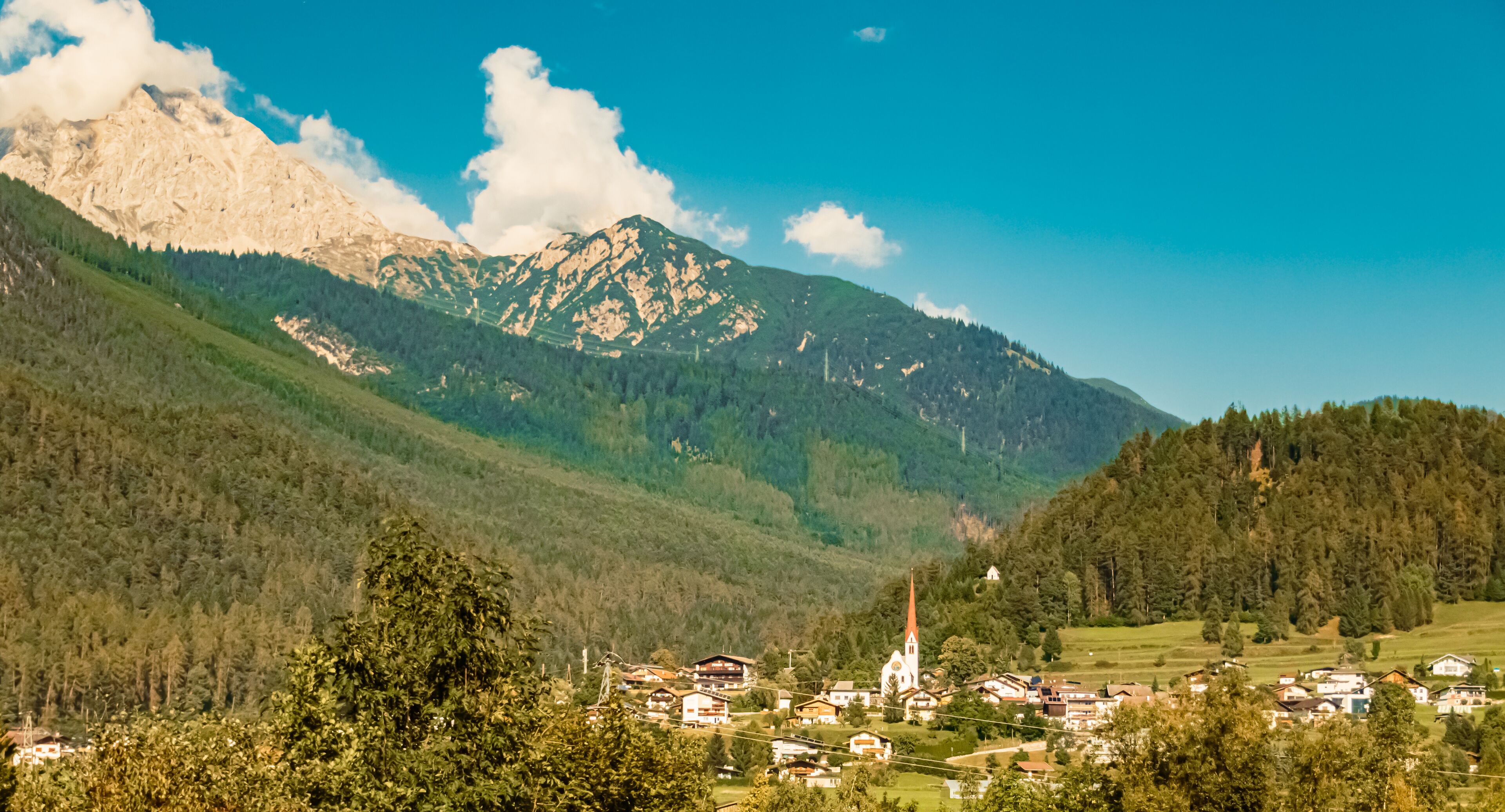 Alpine summer view with a church near Nassereith, Imst, Tyrol, Austria