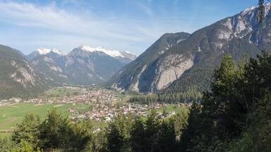 A mountainous landscape with a town nestled in a valley.