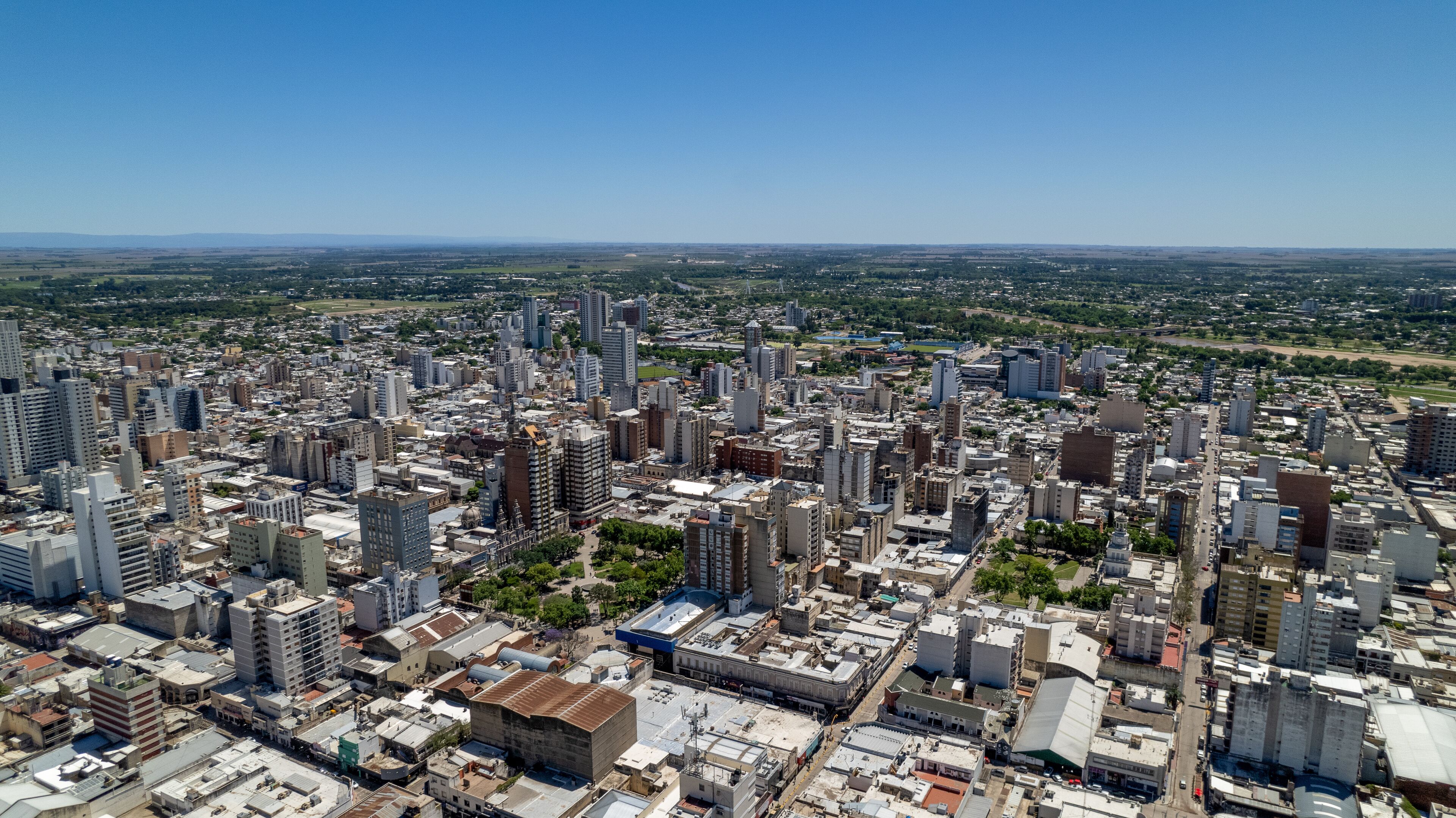 A densely built urban area with numerous high-rise buildings and a mix of older and modern architecture.