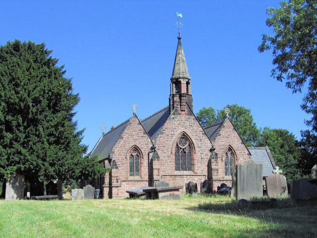 A church with a tall steeple and a clock tower.