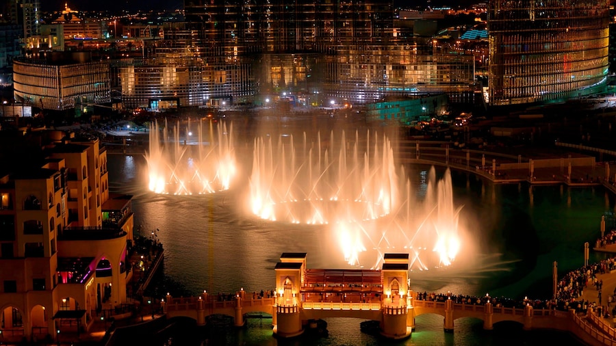 The Dubai Fountain showing a fountain, central business district and a bridge