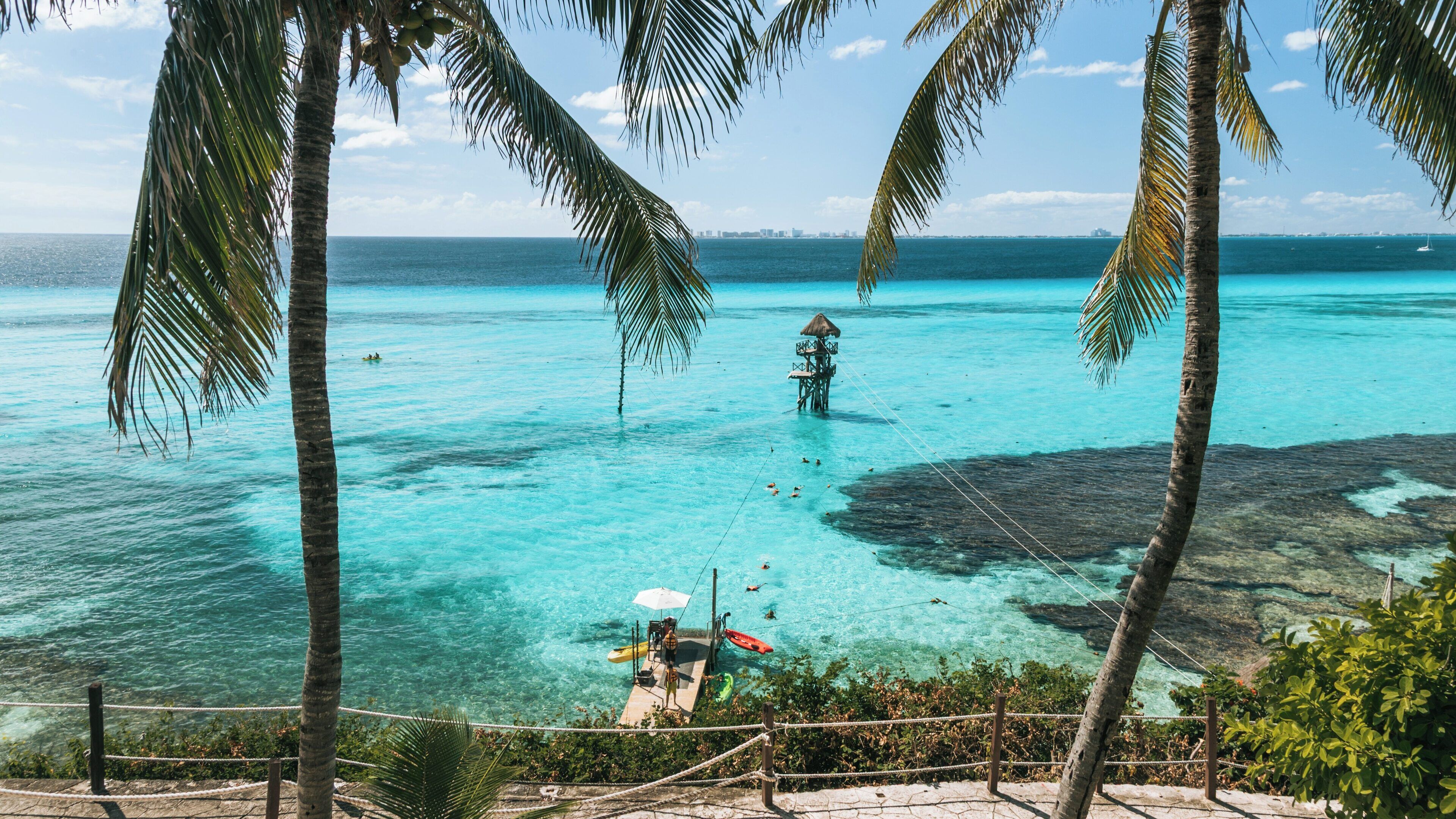 Explore Garrafon Natural Reef Park in Isla Mujeres, Mexico with Stunning Views of Turquoise Waters and Vibrant Coral Reefs