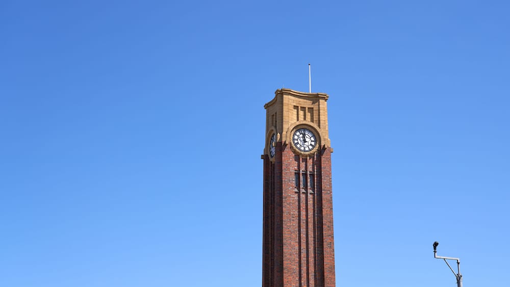 Tall memorial clock tower in Coalville, Leicestershire, UK