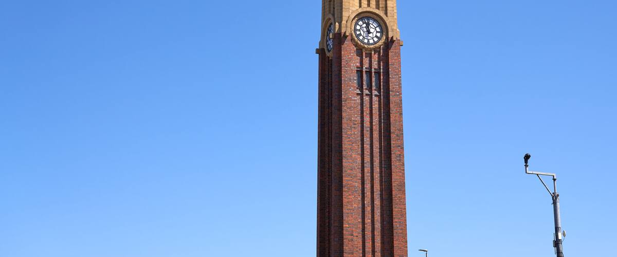 Tall memorial clock tower in Coalville, Leicestershire, UK