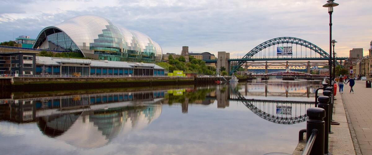 Quayside showing a river or creek, a bridge and modern architecture