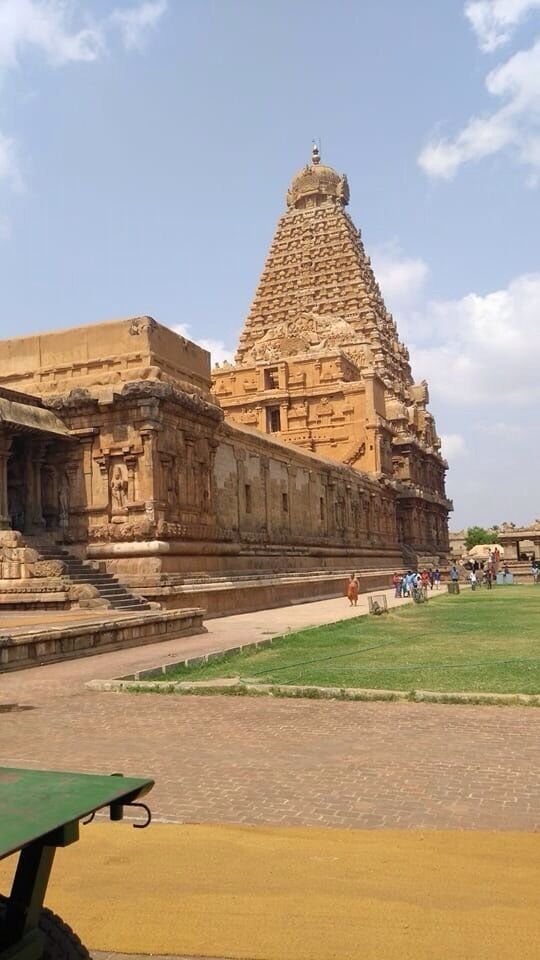 The Thanjavur Temple - World Heritage Site - UNESCO.

The temple stands amidst fortified walls that were probably added in the 16th century. The vimanam (temple tower) is 198 ft (60 m) high and is one of the tallest in the world. The Kumbam (the apex or the bulbous structure on the top) weighs around 80 tons.There is a big statue of Nandi (sacred bull), carved out of a single rock measuring about 16 ft (4.9 m) long and 13 ft (4.0 m) high at the entrance.[ The entire temple structure is made out of granite, the nearest sources of which are about 60 km to the west of temple. The temple is one of the most visited tourist attractions in Tamil Nadu.