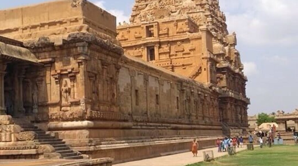The Thanjavur Temple - World Heritage Site - UNESCO.
The temple stands amidst fortified walls that were probably added in the 16th century. The vimanam (temple tower) is 198 ft (60 m) high and is one of the tallest in the world. The Kumbam (the apex or the bulbous structure on the top) weighs around 80 tons.There is a big statue of Nandi (sacred bull), carved out of a single rock measuring about 16 ft (4.9 m) long and 13 ft (4.0 m) high at the entrance.[ The entire temple structure is made out of granite, the nearest sources of which are about 60 km to the west of temple. The temple is one of the most visited tourist attractions in Tamil Nadu.