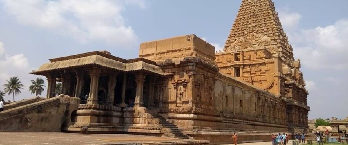 The Thanjavur Temple - World Heritage Site - UNESCO.
Peruvudaiyar Aalayam, Big Temple (locally known as "Thanjai Periya Kovil") is a Hindu temple dedicated to Shiva located in Thanjavur in the Indian state of Tamil Nadu. It is also known as RajaRajeswara Temple Rajarajeswaram and Peruvudayar Temple. It is one of the largest temples in India and is an example of Dravidian architecture during the Chola period. Built by Raja Raja Chola I and completed in 1010 CE, the temple turned 1000 years old . The temple is part of the UNESCO World Heritage Site known as the "Great Living Chola Temples", with the other two being the Peruvudaiyar Temple, Gangaikonda Cholapuram and Airavatesvara temple.
The temple stands amidst fortified walls that were probably added in the 16th century. The vimanam (temple tower) is 198 ft (60 m) high and is one of the tallest in the world. The Kumbam (the apex or the bulbous structure on the top) weighs around 80 tons.There is a big statue of Nandi (sacred bull), carved out of a single rock measuring about 16 ft (4.9 m) long and 13 ft (4.0 m) high at the entrance.[ The entire temple structure is made out of granite, the nearest sources of which are about 60 km to the west of temple. The temple is one of the most visited tourist attractions in Tamil Nadu.