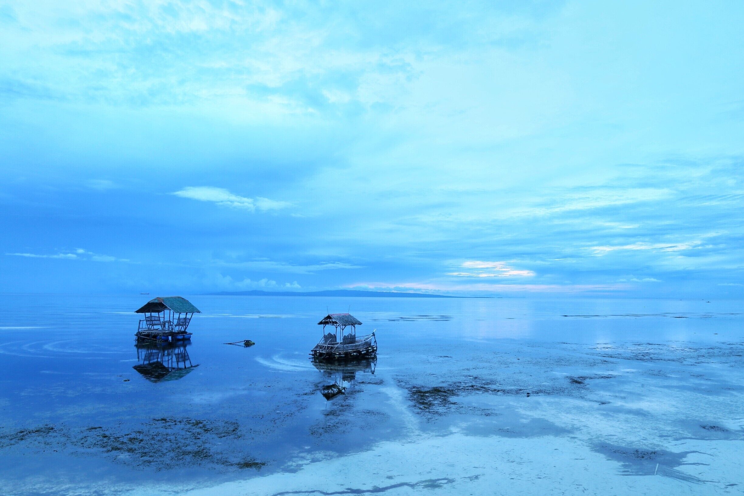 Swimming with whale shark in early  morning is lifetime experiences but before you go there do not forget to watch the breathtaking sunrise view in Oslob.
#LifeAtExpedia

#Philippines
#Cebu
#Travel
#Sunrise
#Blue
#Ocean