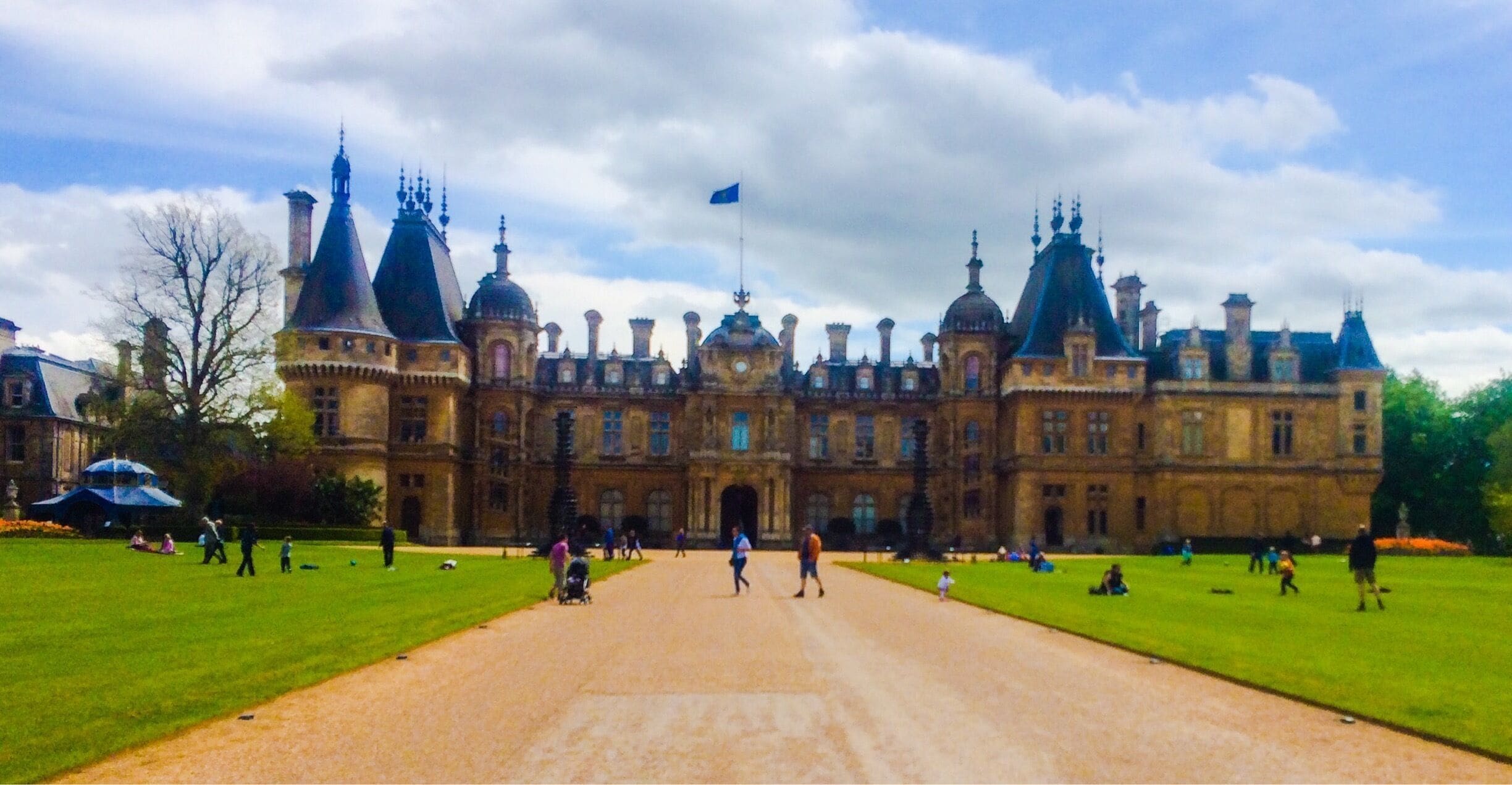 The manor was built for Baron Ferdinand de Rothschild in the Neo-Renaissance style of a French château. 
Aviary, lovely gardens, fountains, stables and nice shop. Apparently it's really nice for the Christmas lights as well. 