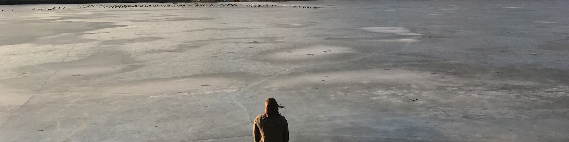 I took this of my Twin sister. I love how the frozen lake looks at this time of day.