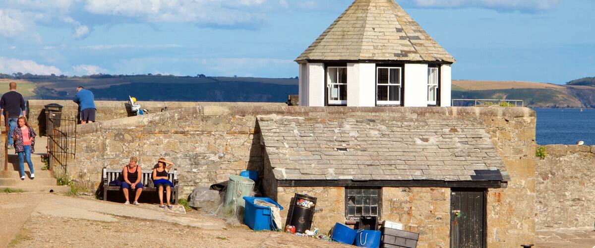 Charlestown showing general coastal views and a house as well as a small group of people