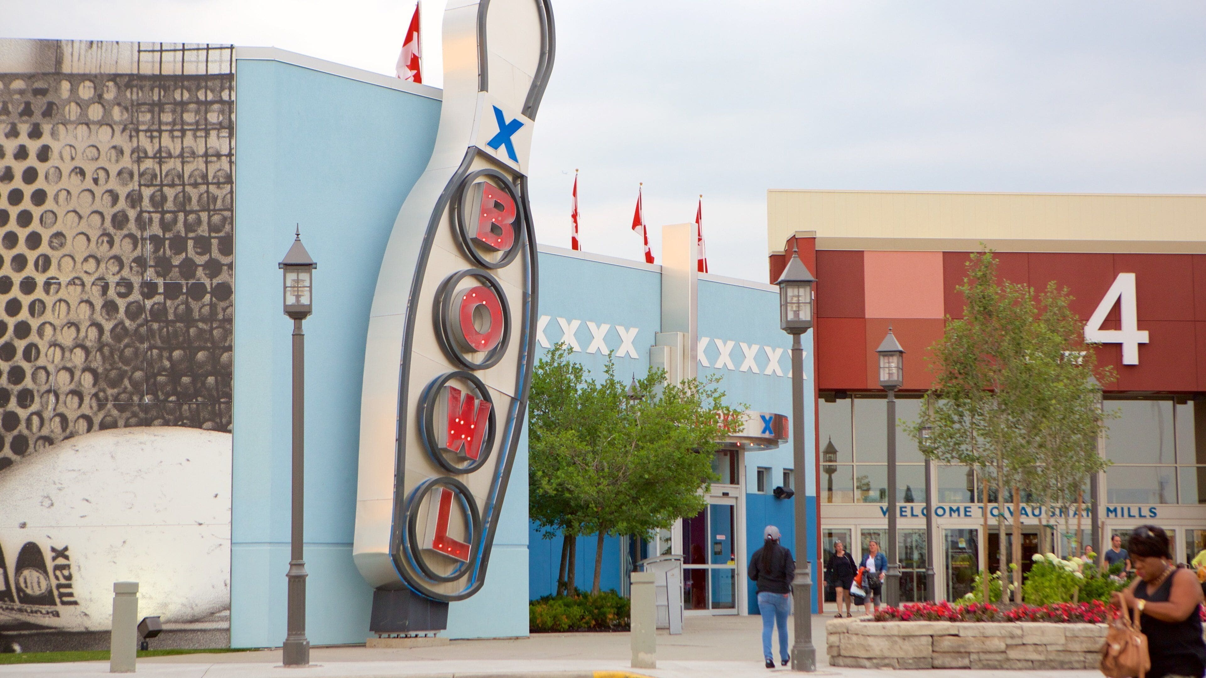 Vaughan Mills Mall which includes a square or plaza and signage as well as a small group of people