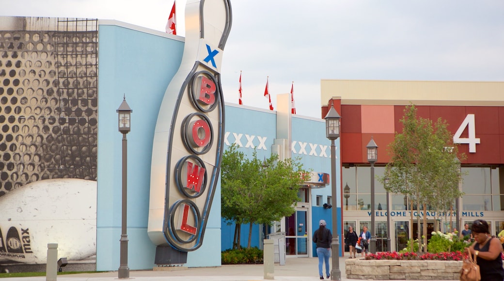 Vaughan Mills Mall which includes a square or plaza and signage as well as a small group of people