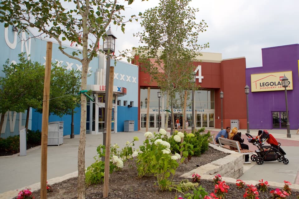 A shopping plaza with a blue building, a purple building, and a sign for Legoland Discovery Center.
