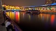 Clarke Quay Mall showing boating, night scenes and a city