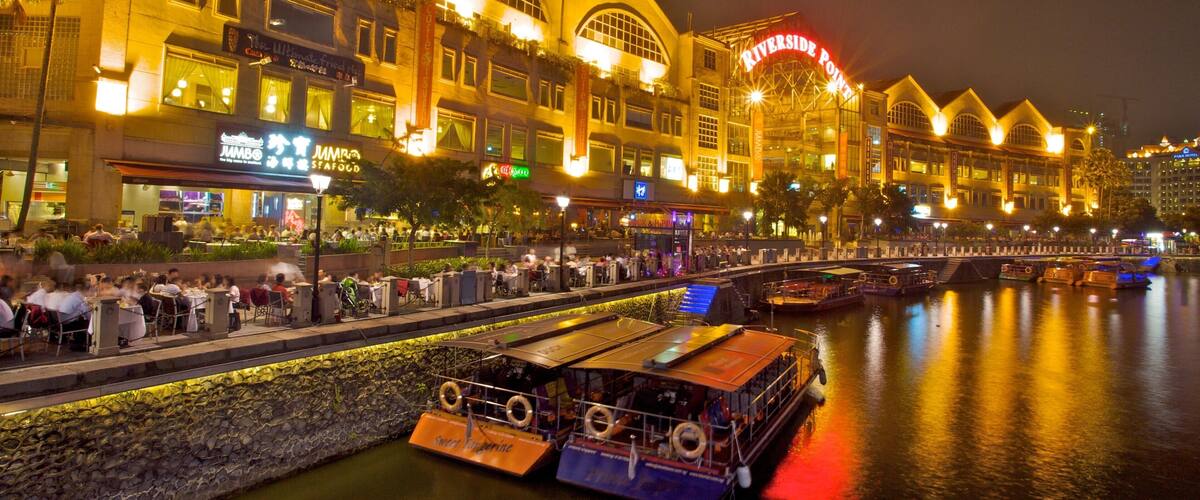 Clarke Quay which includes boating, a bay or harbor and modern architecture