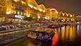Clarke Quay Mall showing night scenes, modern architecture and a bay or harbour