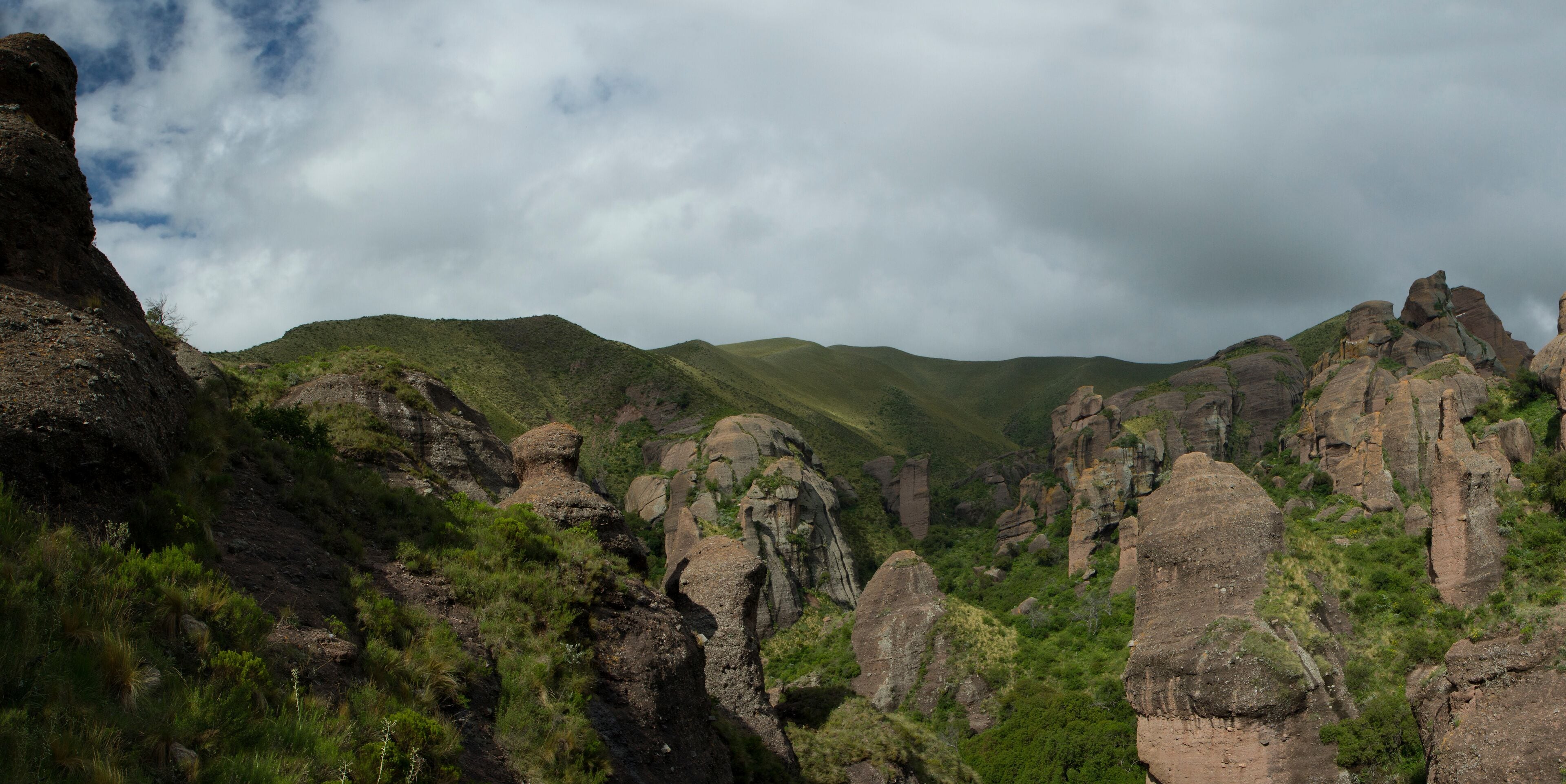 The Moon Valley. Panorama view of the mountains, green forest and rock formations called Los Terrones, in Cordoba, Argentina.
