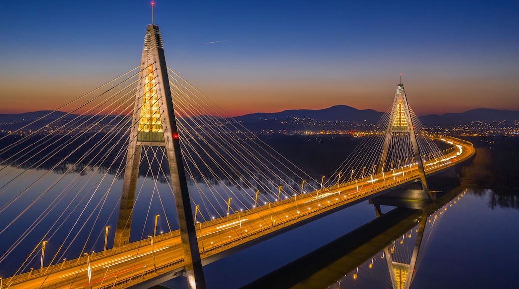 Budapest, Hungary - Aerial view of the illuminated Megyeri Bridge at dusk with clear blue sky