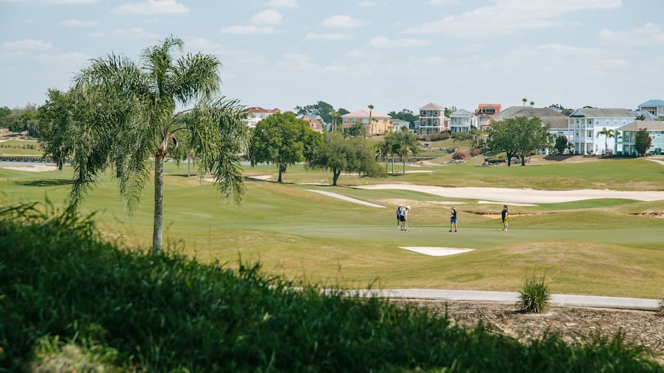 Reunion which includes golf and landscape views as well as a small group of people