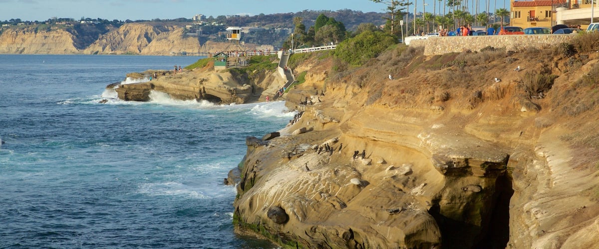 La Jolla featuring a coastal town, rocky coastline and general coastal views