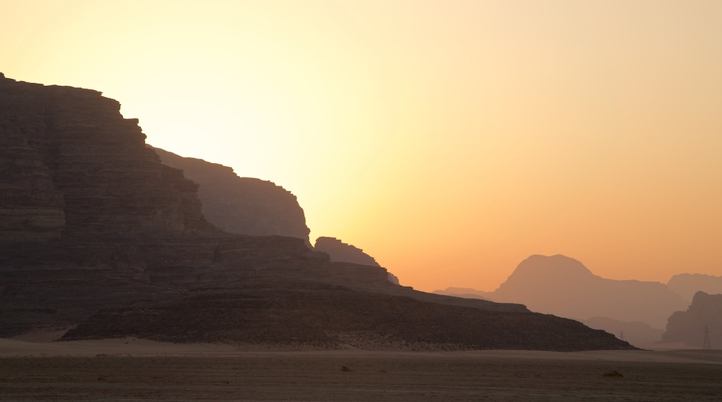 Wadi Rum which includes a sunset, desert views and a gorge or canyon