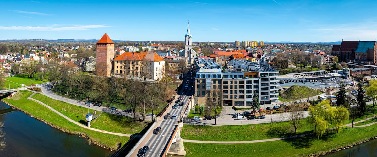 A river, a bridge, a tower, and a church.