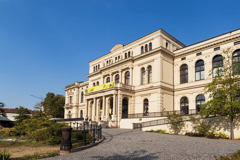 A historic building with arched windows and a central entrance.