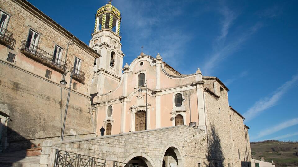 A historic church with a bell tower and arched windows.