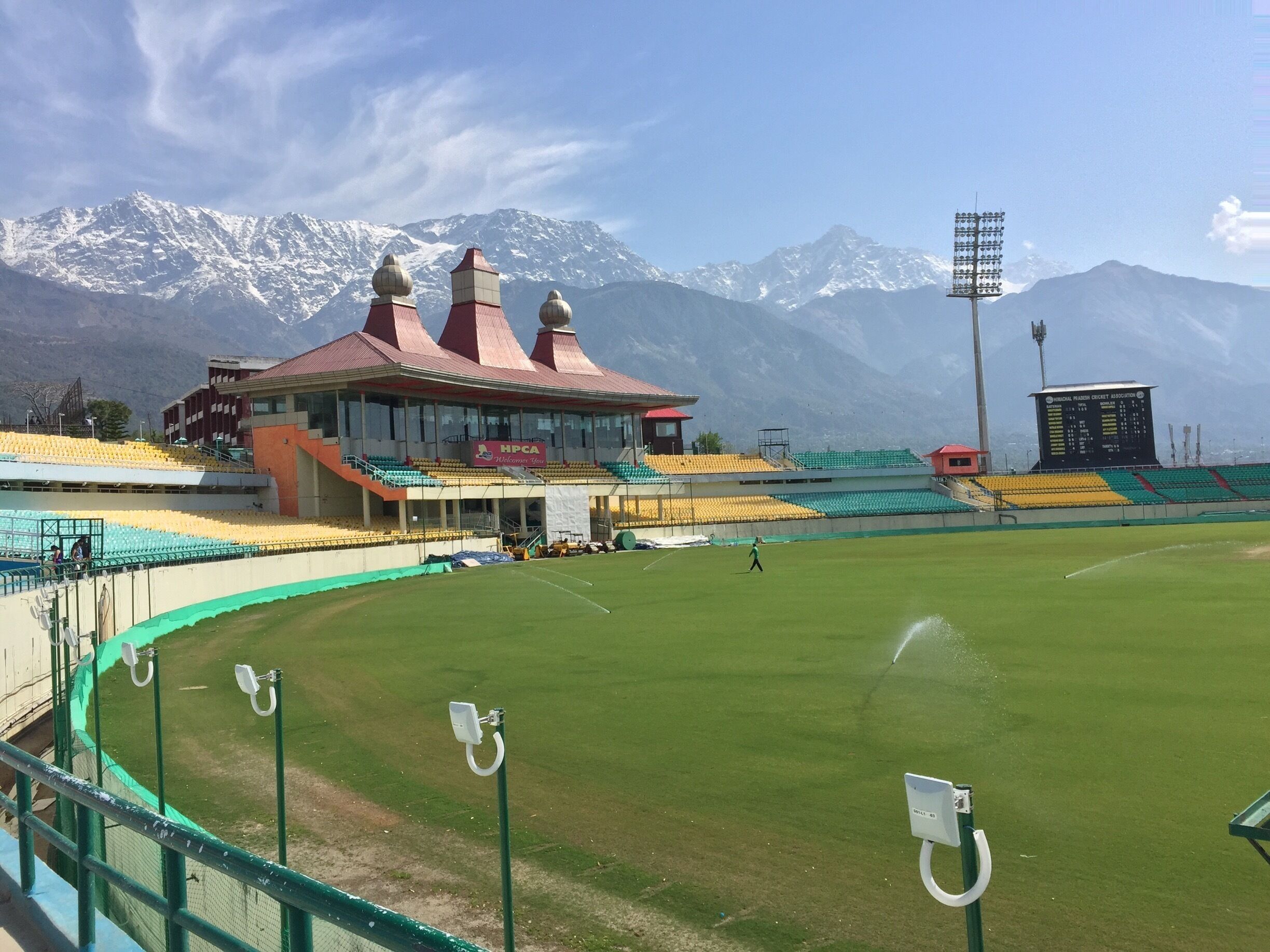 Cricket stadium at the foot of the Himalayas in Dharamsala.

https://en.wikipedia.org/wiki/Himachal_Pradesh_Cricket_Association_Stadium
