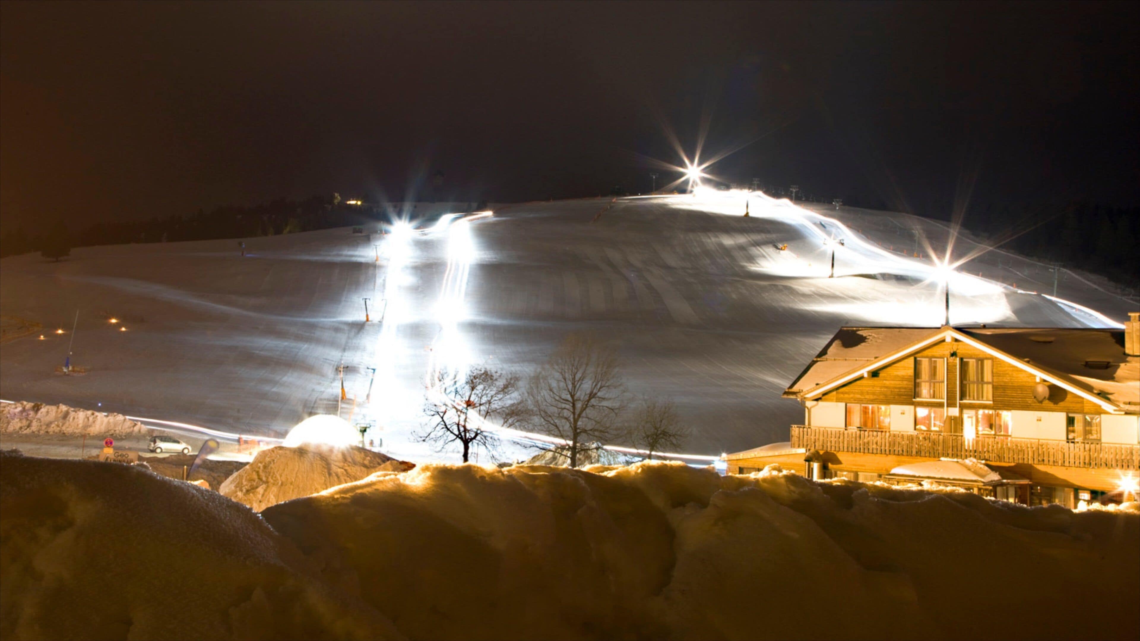 Feldberg Ski Resort featuring night scenes, a luxury hotel or resort and snow