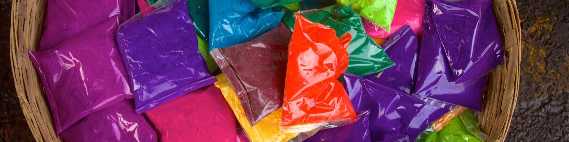 A basket filled with colorful plastic bags.