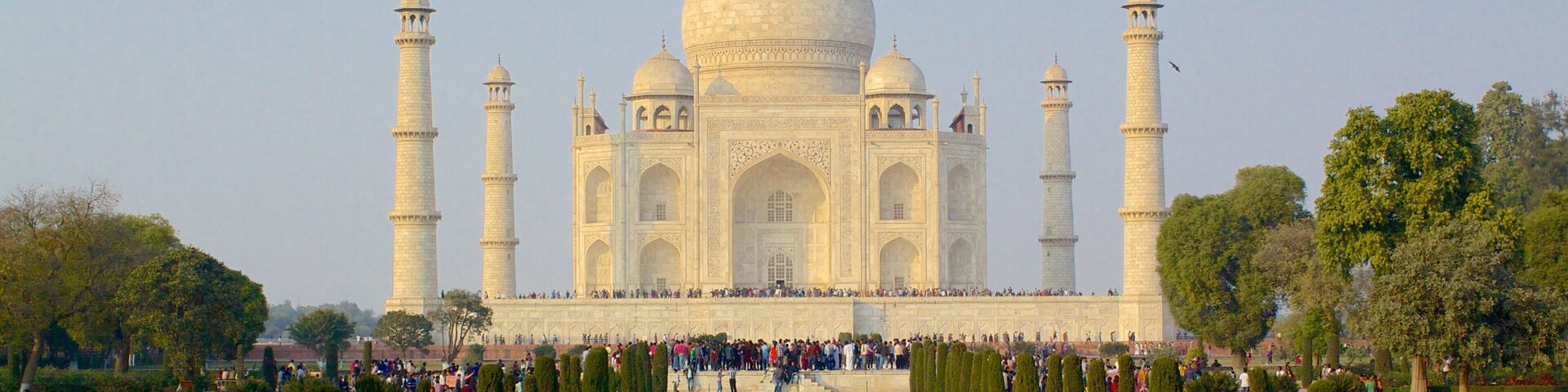 Taj Mahal which includes a temple or place of worship and heritage elements as well as a large group of people