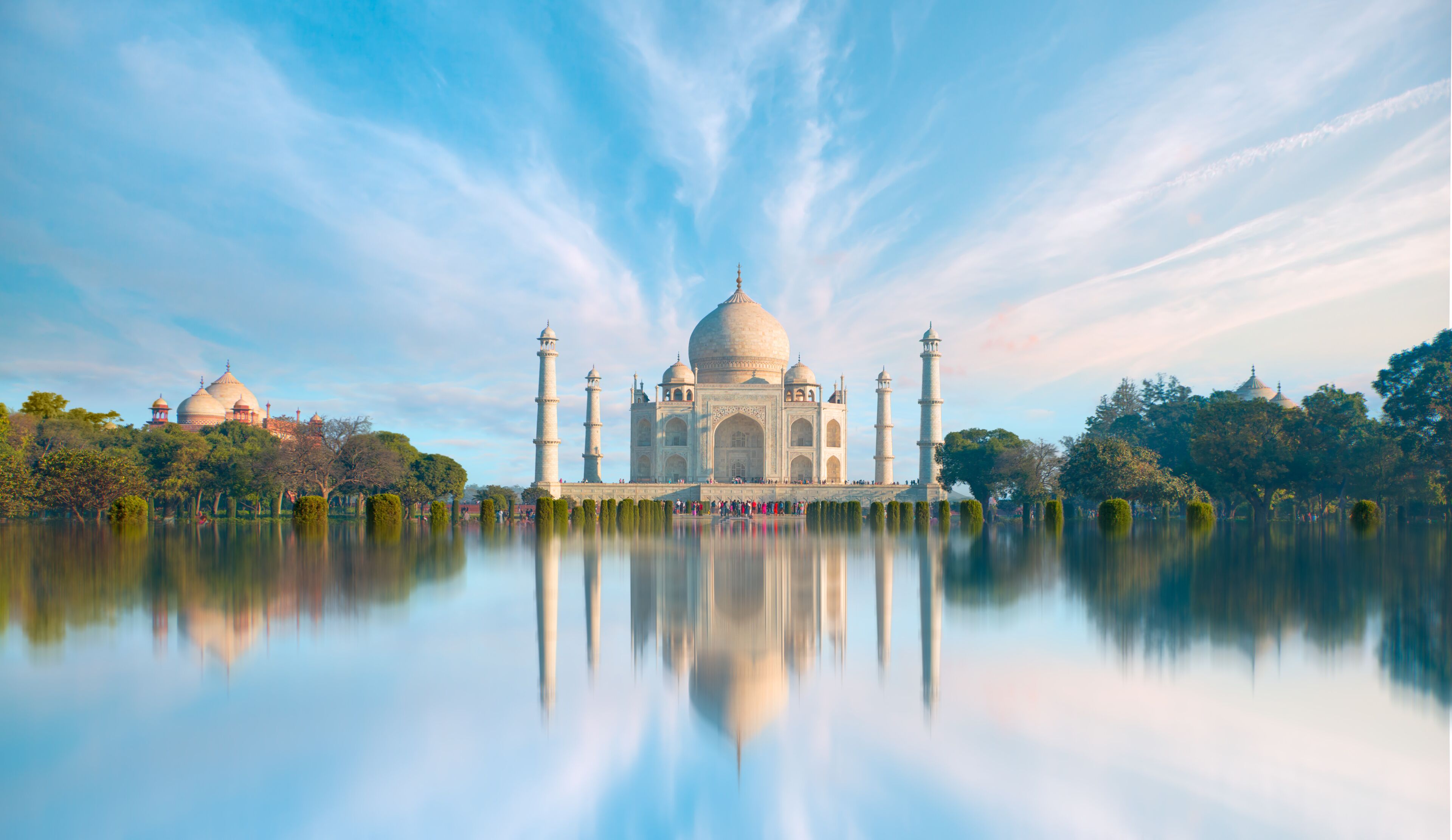Panoramic view of Taj Mahal during bright blue sky reflected in water - Agra , Uttar Pradesh, India