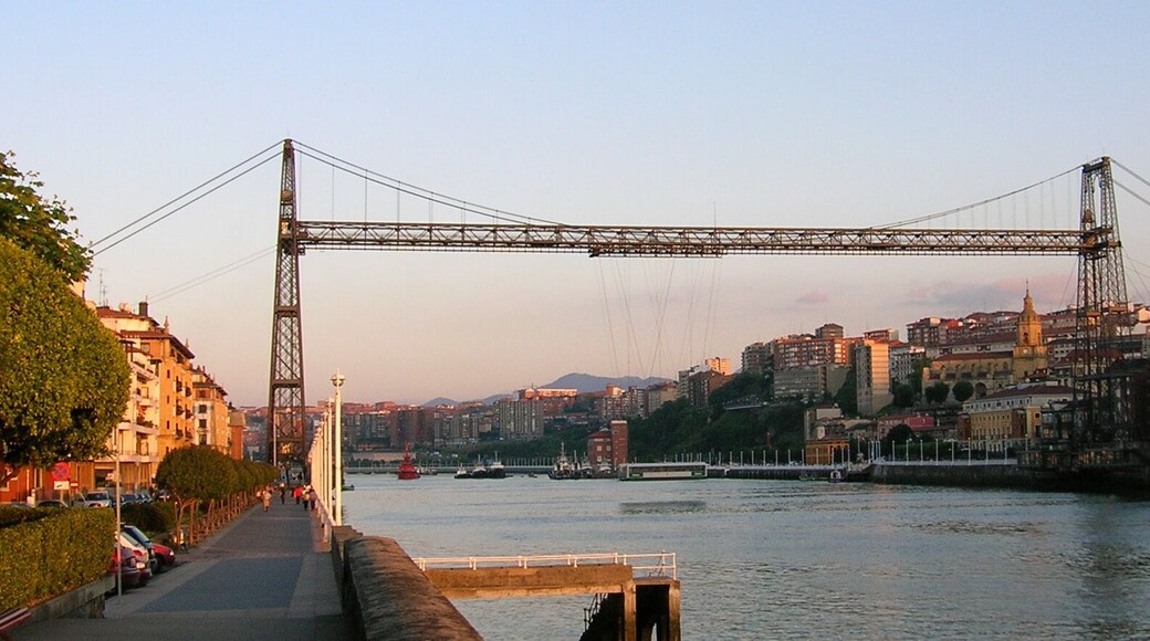 Bizkaia Zubia (Biscay Bridge) Transporter Bridge between Portugalete a Las Arenas - Areeta. The upper horizontal span is a footbridge that can be accessed through lifts (elevators).