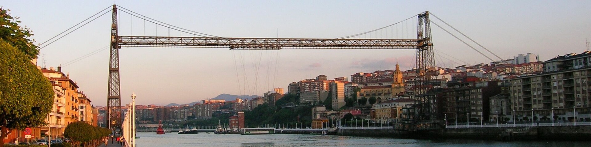 Bizkaia Zubia (Biscay Bridge) Transporter Bridge between Portugalete a Las Arenas - Areeta. The upper horizontal span is a footbridge that can be accessed through lifts (elevators).