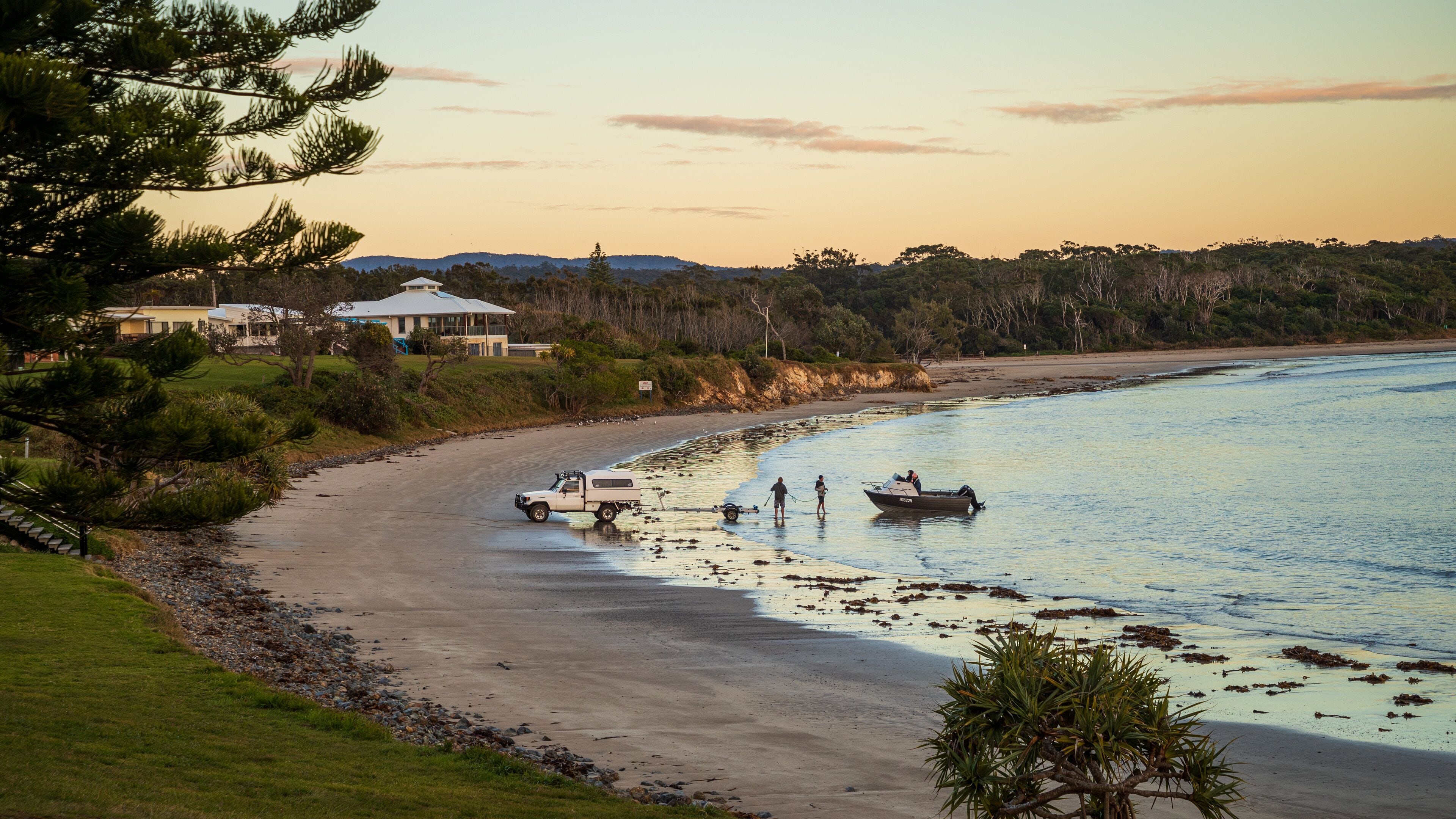 Woolgoolga featuring a sunset, a coastal town and general coastal views